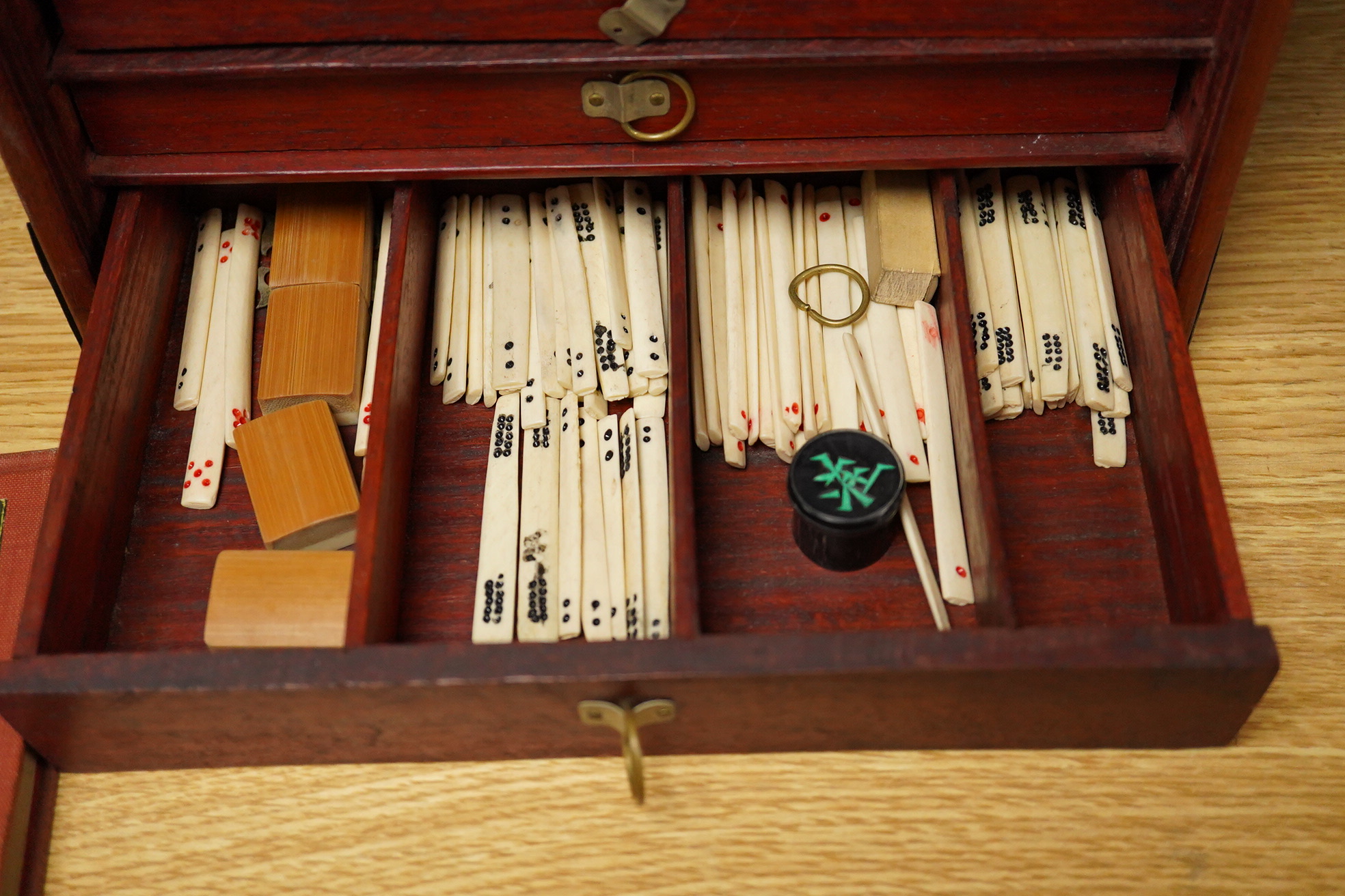 A Mah jong set an related book 24cm x 16.5cm high